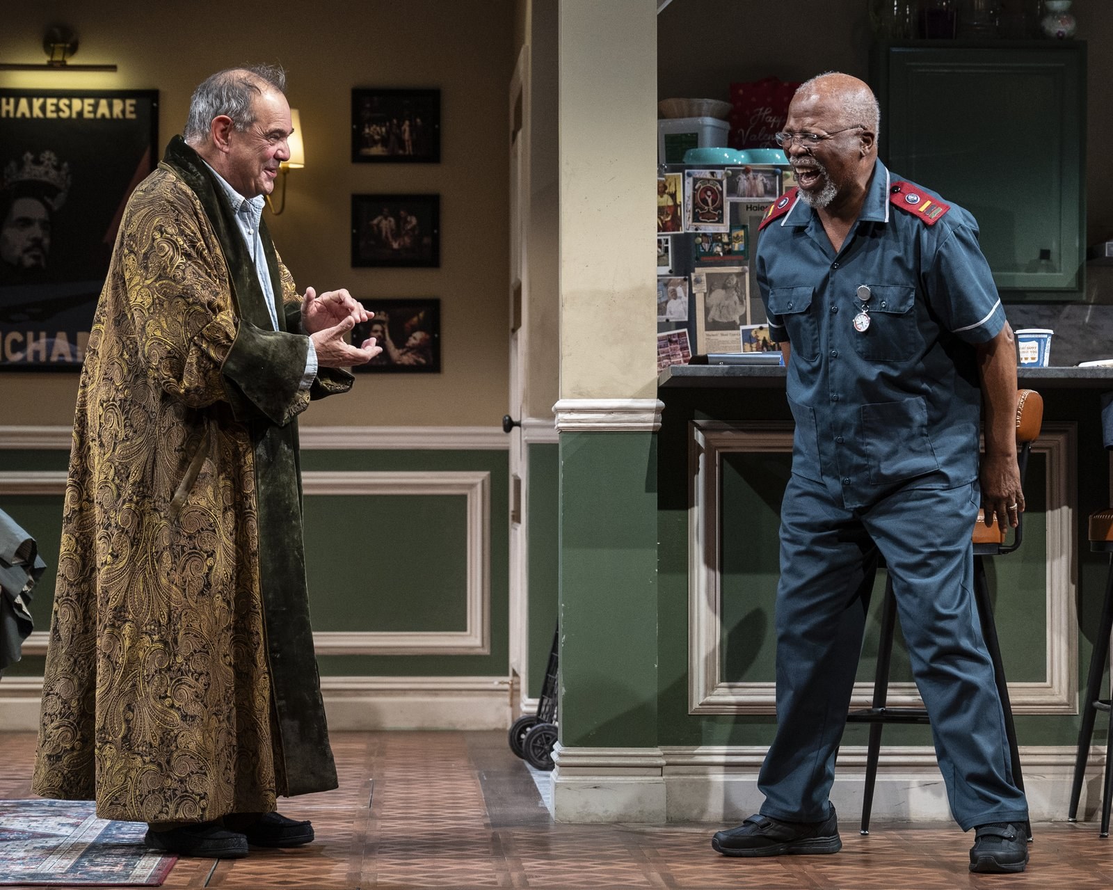 Jack Morris in a gold dressing gown faces Lunga Kunene in his nurse's uniform