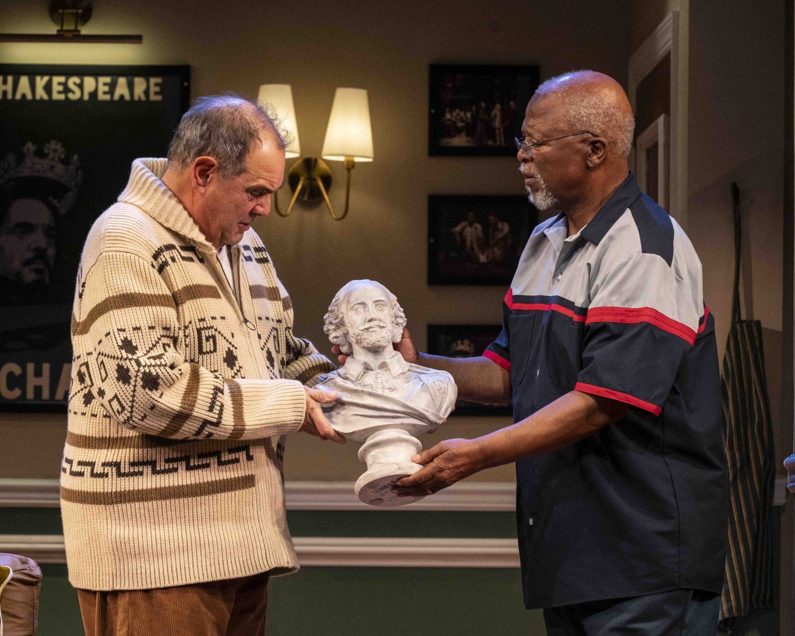 Jack Morris hands Lunga Kunene a bust of Shakespeare